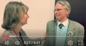 Dr. Nancy Young, DCG Dean, congratulates Dr. Frederick Rueggeberg.